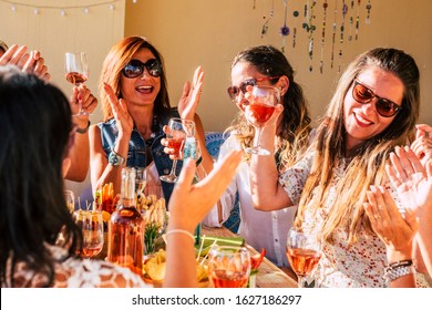 Young Group Of Women Have Fun And Laugh A Lot During Lunch At Restaurant Or Home All Together In Friendship - Female People Friends With Food And Drinks