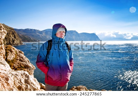 young guy admires the view of the sea