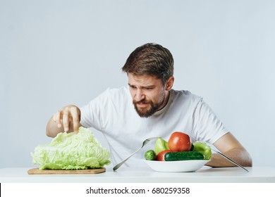 Young Guy With Beard On White Isolated Background, Vegetables, Vegan, Healthy Eating Right.