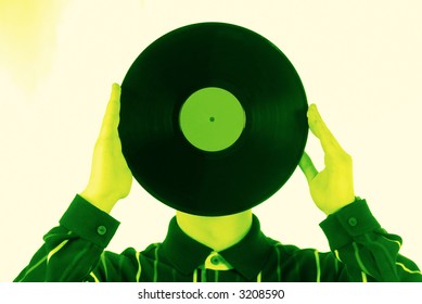 young guy before itself an old vinyl plate in hands