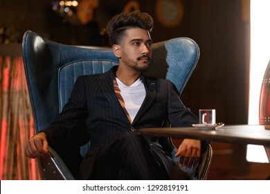 young guy in a cafe - Shutterstock ID 1292819191