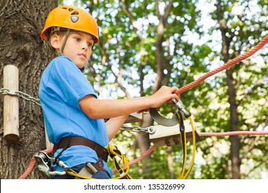Young guy with climber equipment focused  for moving.