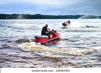 Young Guy Cruising On The Lake On A Jet Ski 