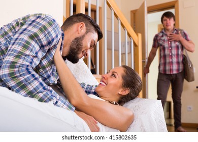 Young Guy Discovering His Cheating Girlfriend At Home
