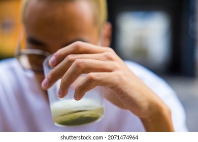 A Young Guy Drinking A Delicious Cold Matcha Tea