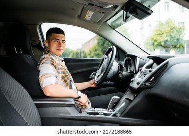 Young Guy Driving A Car