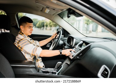 Young Guy Driving A Car