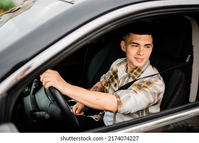 Young Guy Driving A Car