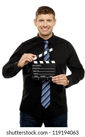 Young Guy Holding Clapboard. Its Showtime