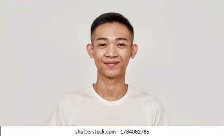 Young Guy. Portrait Of Young Asian Man With Clean Shaven Face Smiling At Camera Isolated Over White Background. Beauty, Skincare, Health Concept. Front View. Web Banner