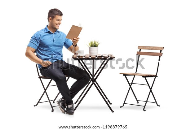 Young Guy Seated Coffee Table Reading Stock Photo 1198879765 | Shutterstock