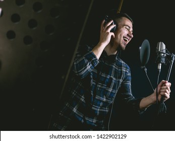 The Young Guy Singing In Recording Studio