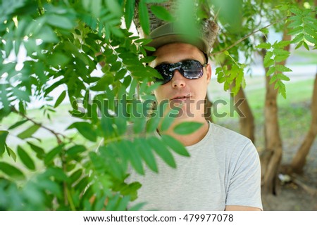 Similar – Portrait of a young man in the bamboo jungle