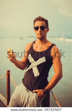 Similar – Close up of young man with sunglasses holding surfboard