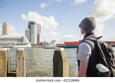 Young Guy Tourist Looking To View Rotterdam City Harbour, Future Architecture Concept, Industrial Lifestyle Real People Concept