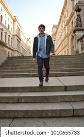 young guy walking down steps