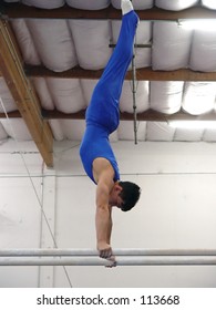 Young Gymnast Competing On Parallel Bars