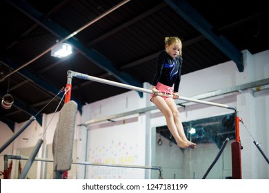 Young gymnast on a horizontal bar - Powered by Shutterstock