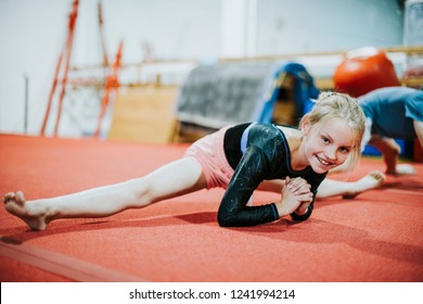 Young Gymnast Stretching Her Body