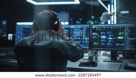 Young Hacker Working Alone, Hacking Corporate Data Servers From His Underground Hideout. Hacktivist Organizes a Massive Data Breach Cyber Attack, Hiding His Identity Behind Multiple Proxy Servers