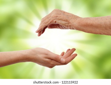  Young  Hand Holding An Older One