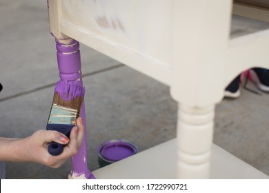 Young Hands Painting Furniture With Paint Brush