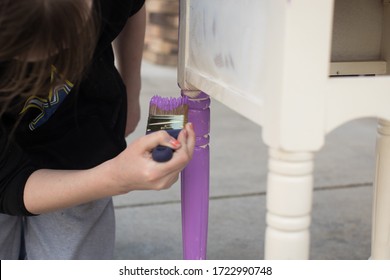 Young Hands Painting Furniture With Paint Brush