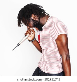 young handsome african american boy singing emotional with microphone isolated on white background, in motion gesturing smiling, lifestyle people concept - Powered by Shutterstock