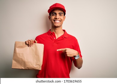 Young Handsome African American Delivery Man Holding Paper Bag With Takeaway Food Very Happy Pointing With Hand And Finger