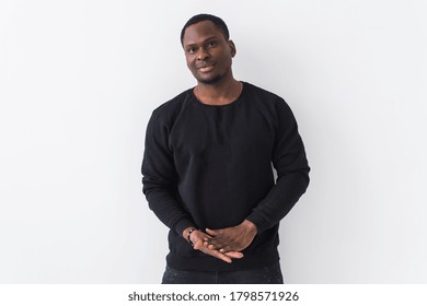 Young Handsome African American Man With An Afro Hairstyle. Portrait On White Background With Copy Space. Guy Looking At Camera.