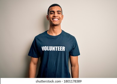 Young handsome african american man volunteering wearing t-shirt with volunteer message with a happy and cool smile on face. Lucky person.