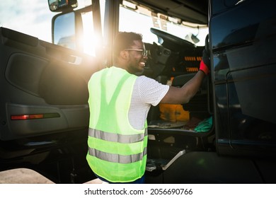 Young Handsome African American Man Working In Towing Service And Driving His Truck.