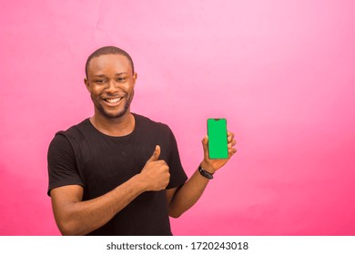 Young Handsome African Man Feeling Excited About What He Saw On His Phone