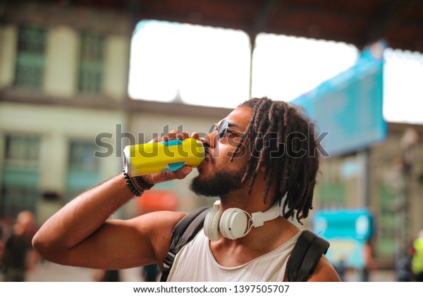 Young Handsome Afro Man Having Drink Stock Photo (Edit Now) 1397505707