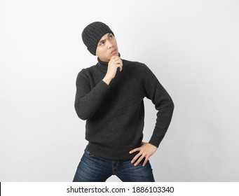 Young handsome asian man wearing grey sweater and beanie thinking an idea while looking up on white background. - Powered by Shutterstock