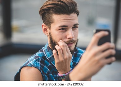 Young Handsome Bearded Hipster Man Selfie In The City