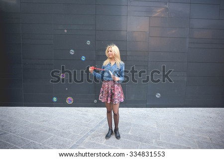 Similar – Young teenage girl blowing pink bubble gum