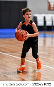 Young Handsome Boy Playing Basketball