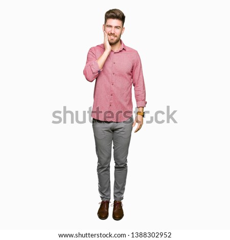 Young handsome business casual man touching mouth with hand with painful expression because of toothache or dental illness on teeth. Dentist concept.
