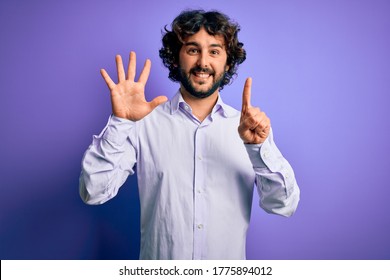 Young handsome business man with beard wearing shirt standing over purple background showing and pointing up with fingers number six while smiling confident and happy. - Shutterstock ID 1775894012