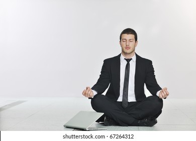 young handsome business man in black suit and tie practice yoga and relax at network server room while representing stres control concept - Powered by Shutterstock