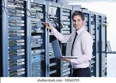 Young Handsome Business Man  Engeneer In Datacenter Server Room