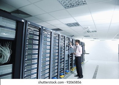 Young Handsome Business Man  Engeneer In Datacenter Server Room