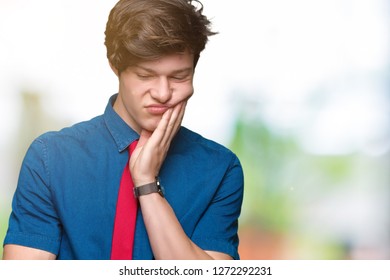 Young handsome business man wearing red tie over isolated background thinking looking tired and bored with depression problems with crossed arms. - Shutterstock ID 1272292231