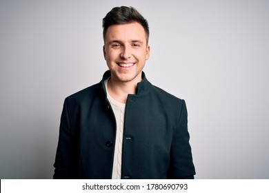 Young Handsome Business Mas Wearing Elegant Winter Coat Standing Over Isolated Background With A Happy And Cool Smile On Face. Lucky Person.