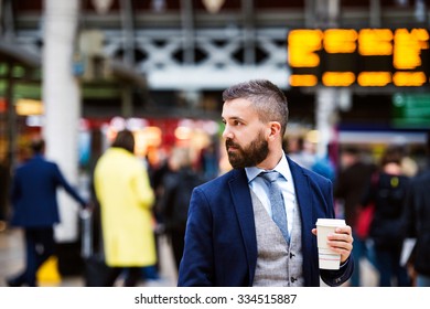 Young handsome businessman with cup of coffee - Powered by Shutterstock