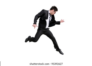 Young handsome businessman with eyeglasses jumping, isolated on white