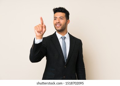 Young handsome businessman man over isolated background touching on transparent screen - Powered by Shutterstock