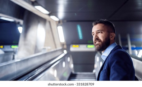 Young handsome businessman in subway on his way to work - Powered by Shutterstock