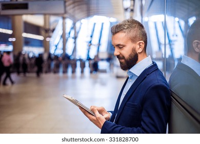 Young handsome businessman with tablet in subway - Powered by Shutterstock